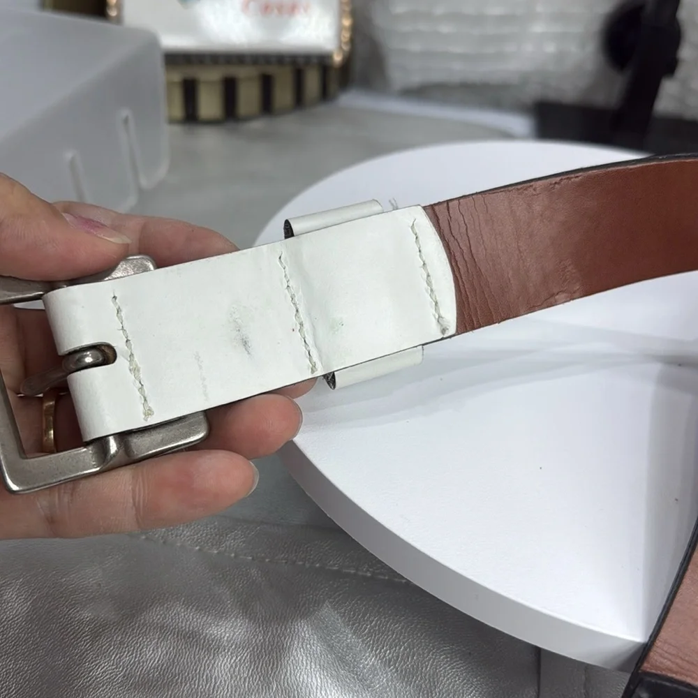 (H)Two Pebble Beach boys' leather belts with black and white metal silve buckles